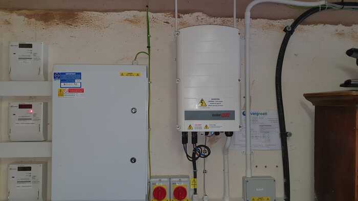 SolarEdge inverter installed in the plant room in a ground source heat pump install
