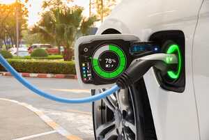 Electric car on charge, with screen showing amount of battery charge